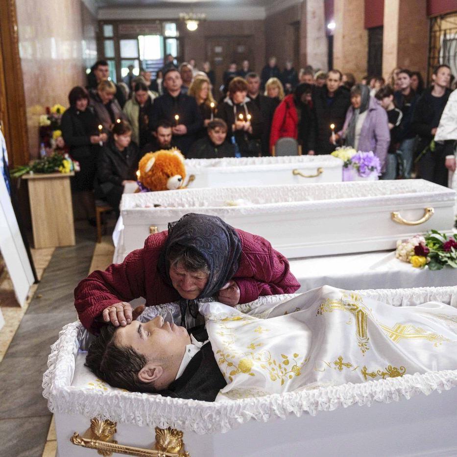 AP PHOTOS: 3 Ukrainian siblings buried after Russian missile strike